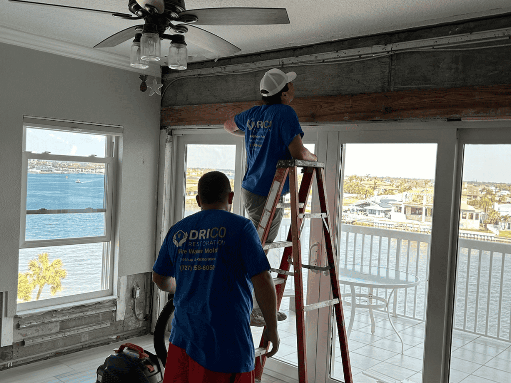Drico Restoration Workers Repairing Flood Damage Inside A Home.
