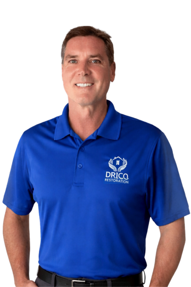 Dan Wallace From Drico Restoration, Smiling In A Blue Polo Shirt, Offering Expert Restoration Services Including Fire, Water, And Mold Damage Restoration.
